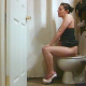 A brunette girl records herself sitting on a toilet and taking very runny-sounding shits from a side view perspective in multiple scenes. Great for diarrhea fans. About 14.5 minutes.